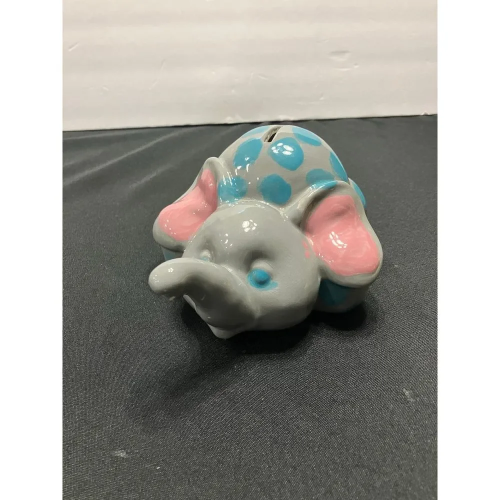 Vintage Elephant piggy bank. Gray with blue dots‎